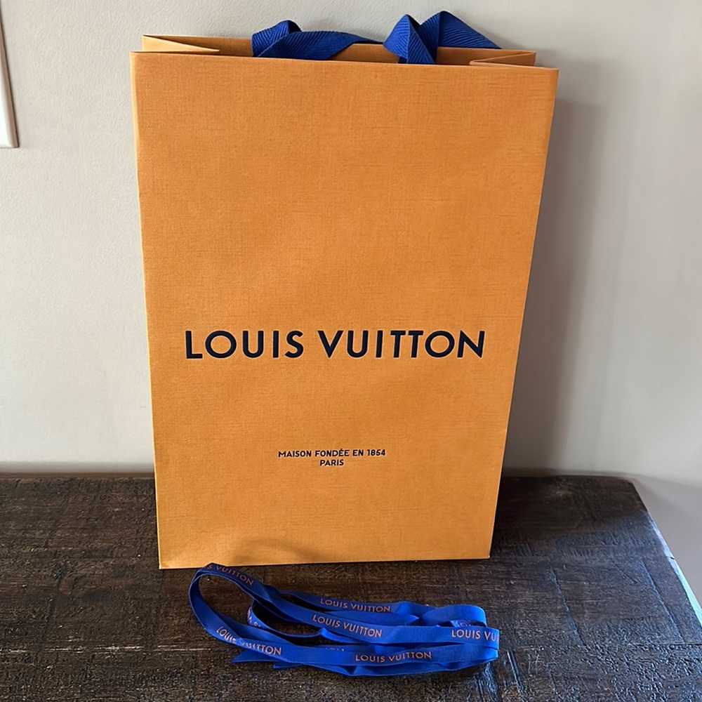 Louis Vuitton bag 14”H x 9.75” Wx 4.5” D Ribbon measures 5’5” long.